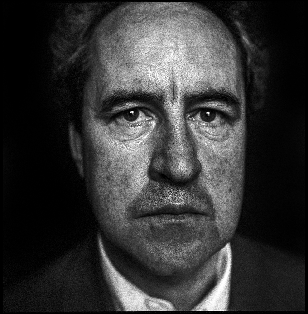Black and white portrait photograph of writer John Banville
