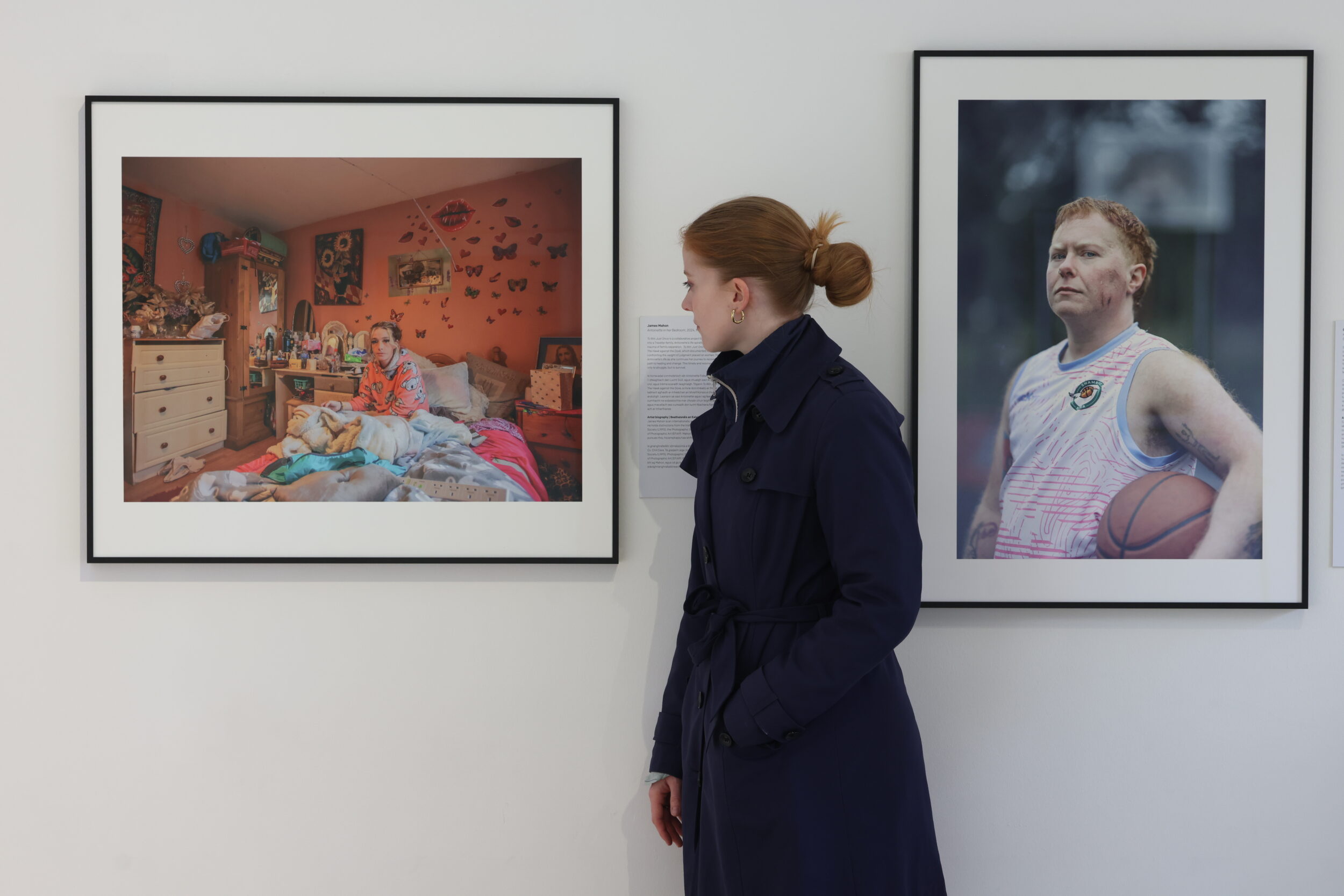 Image of a person looking at the art on display